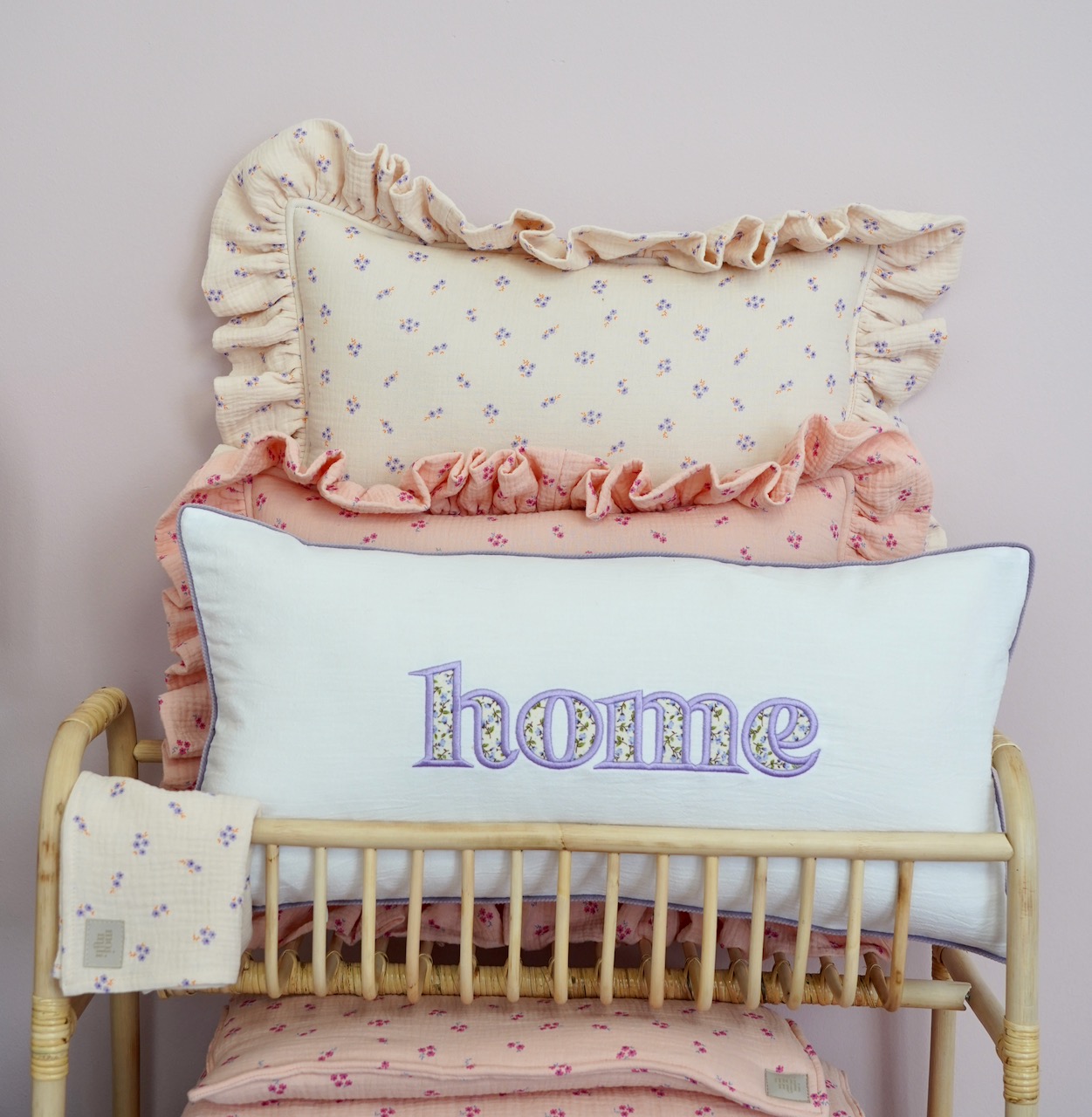 Decorative pillowcase with a floral embroidered inscription "Home"