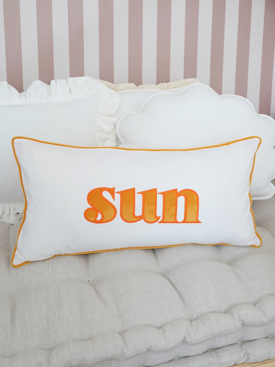Decorative pillowcase with a mustard embroidered inscription "Sun"