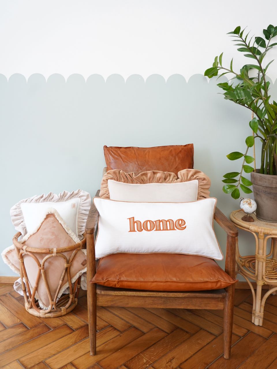 Decorative pillowcase with a beige embroidered inscription "Home"