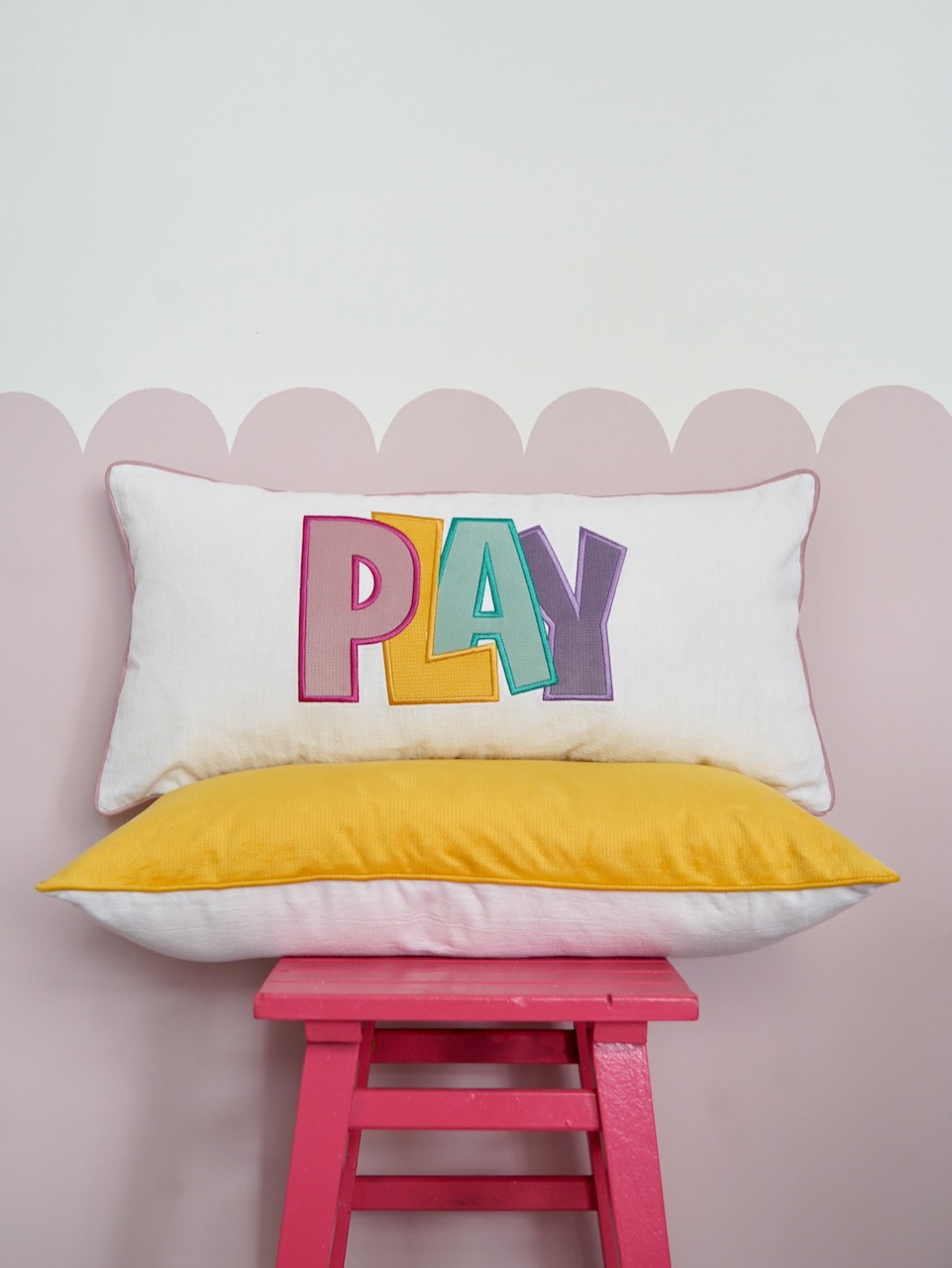 Decorative pillowcase with a colorful embroidered inscription "Play 3"